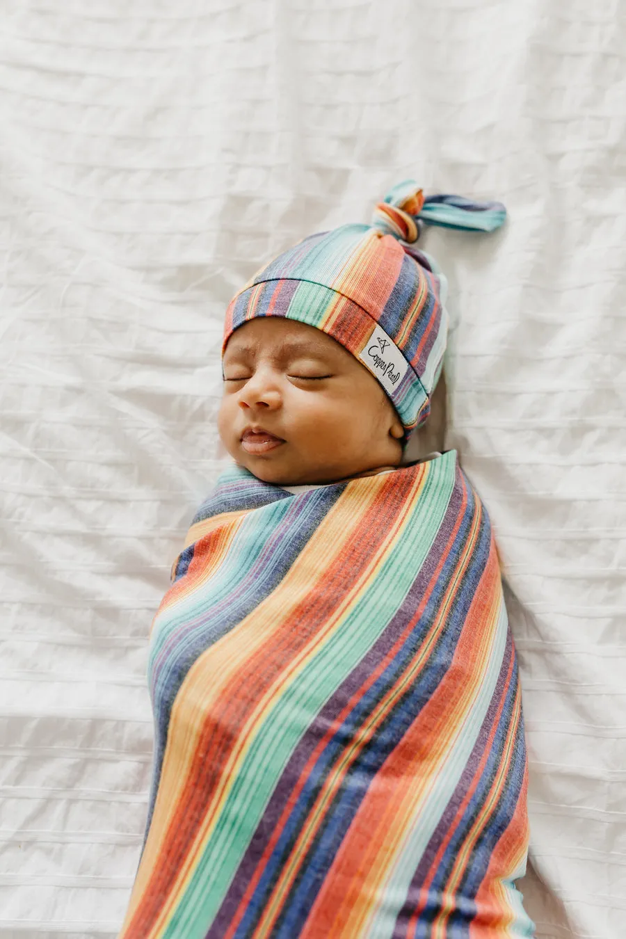 Copper Pearl Serape Top Knot Hat